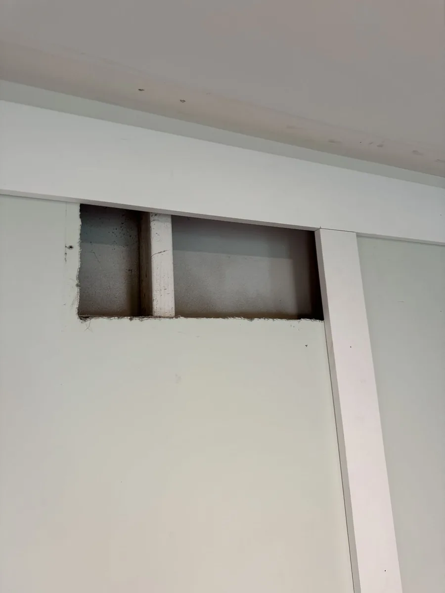 Spray-finished white panels and trim, family room renovation Delaware County