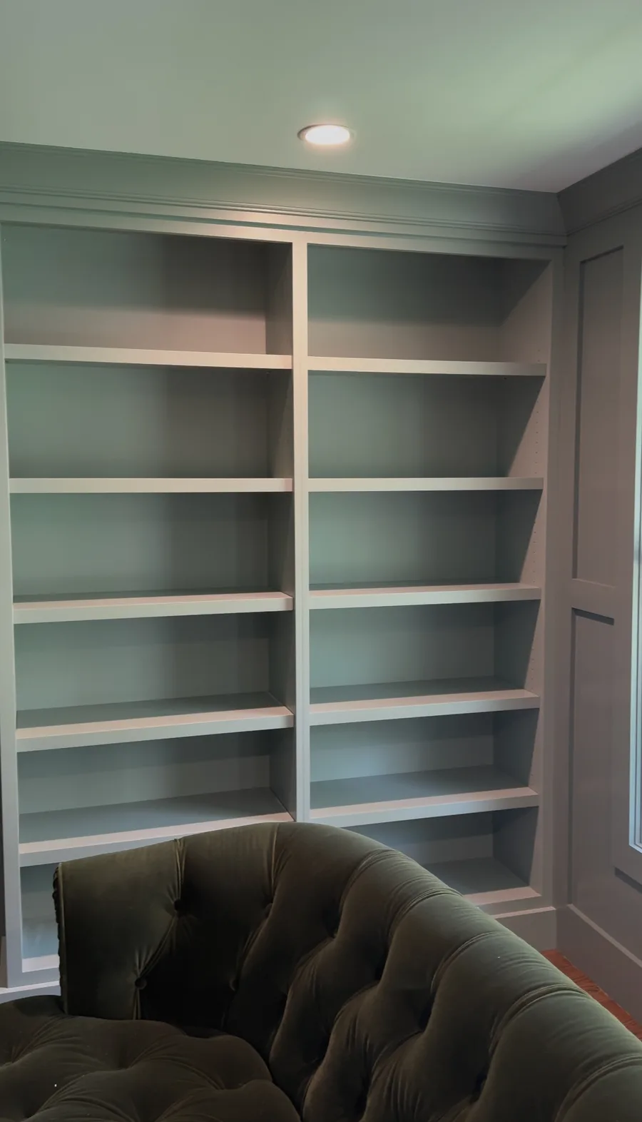Completed open bookcase built-in, sage green family room Newtown Square PA